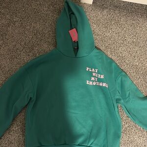 I am selling this edikted green sweatshirt size Large